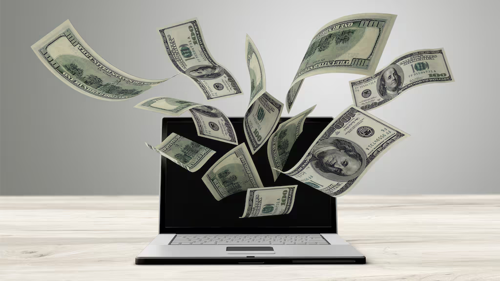 Money flowing out of laptop